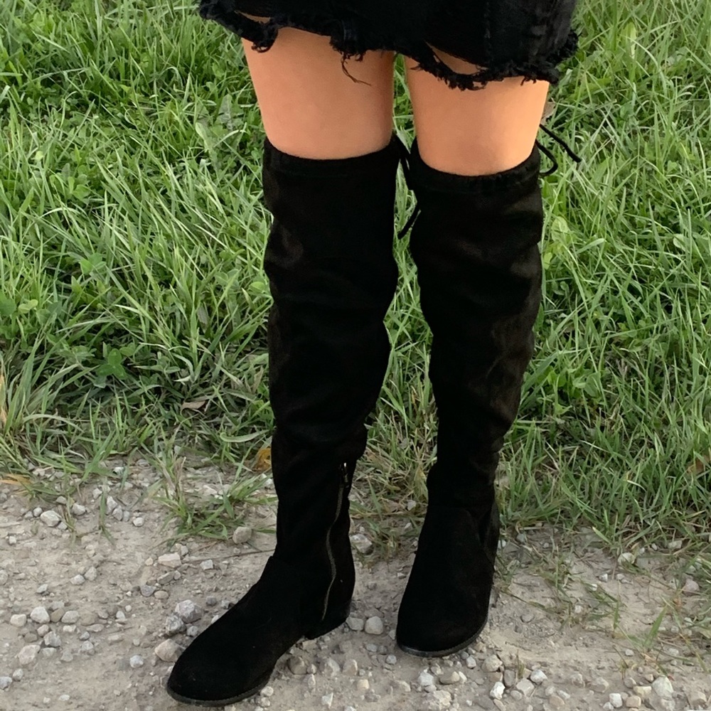 A New Day high legged black boots comes in sizes 8 and 8 1/2.